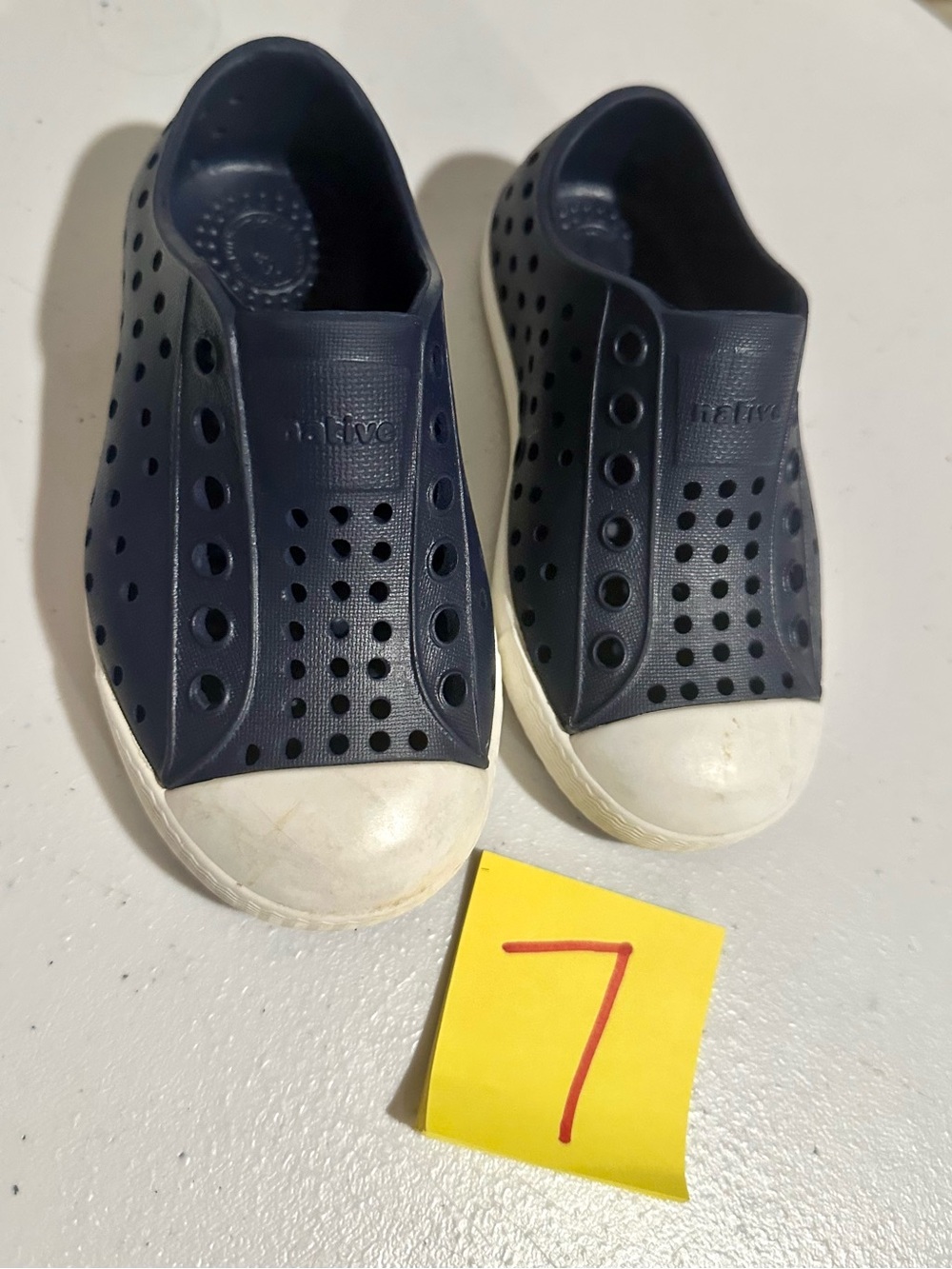 navy blue natives sz 7!